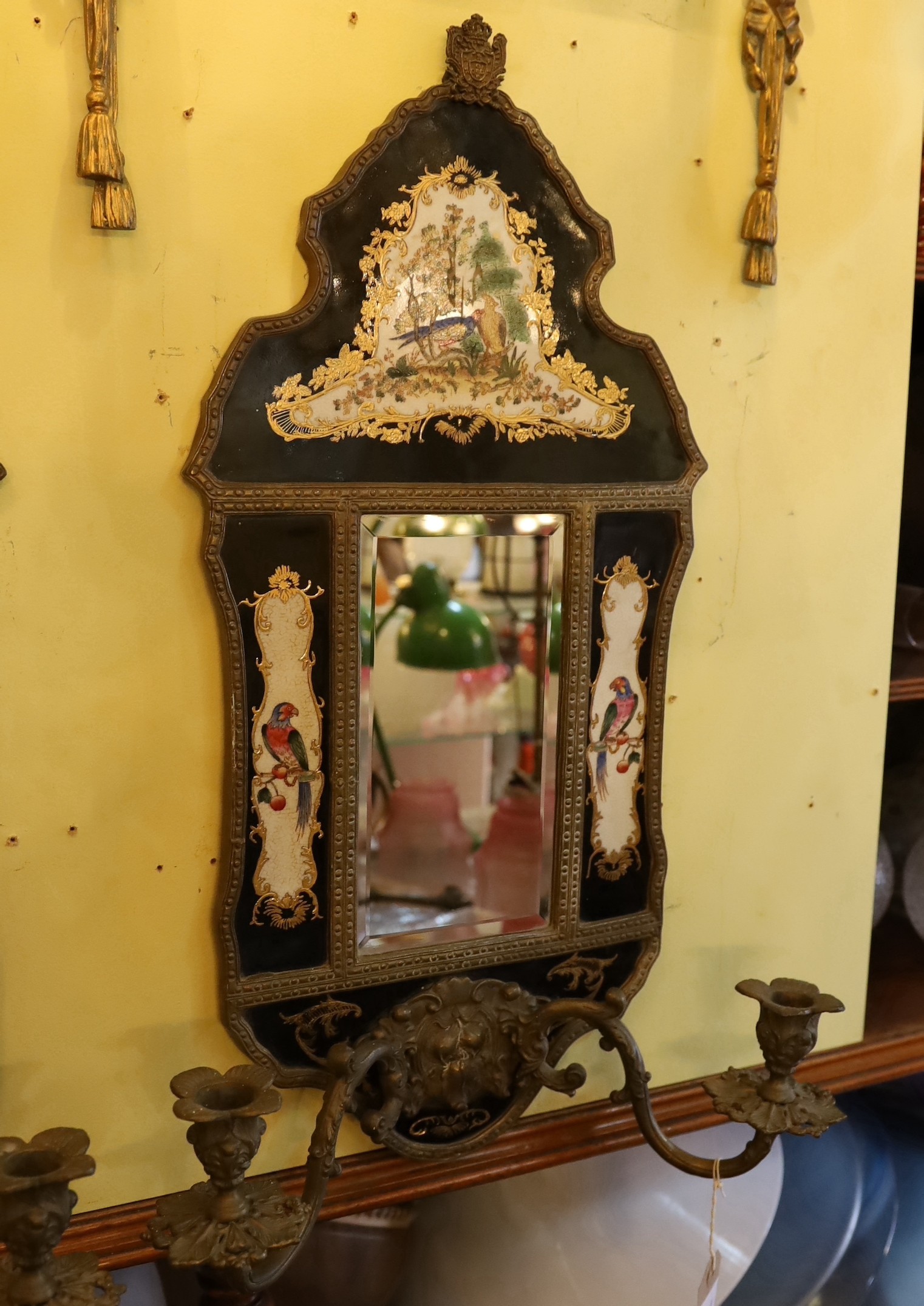 A pair of brass mounted ceramic girandoles in the Louis XIV style, height 64cm. width 38cm